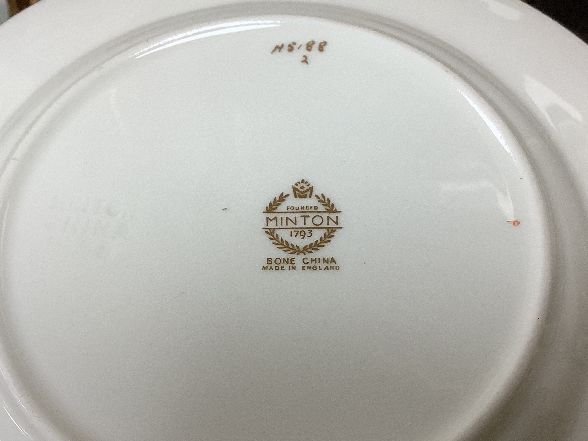 A Mintons breakfast set, a Minton part dinner service and a Woods floral-patterned part dinner service